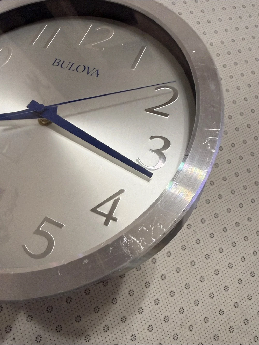 Bulova Silver Wall Clock with Blue Hands and Silver Dial